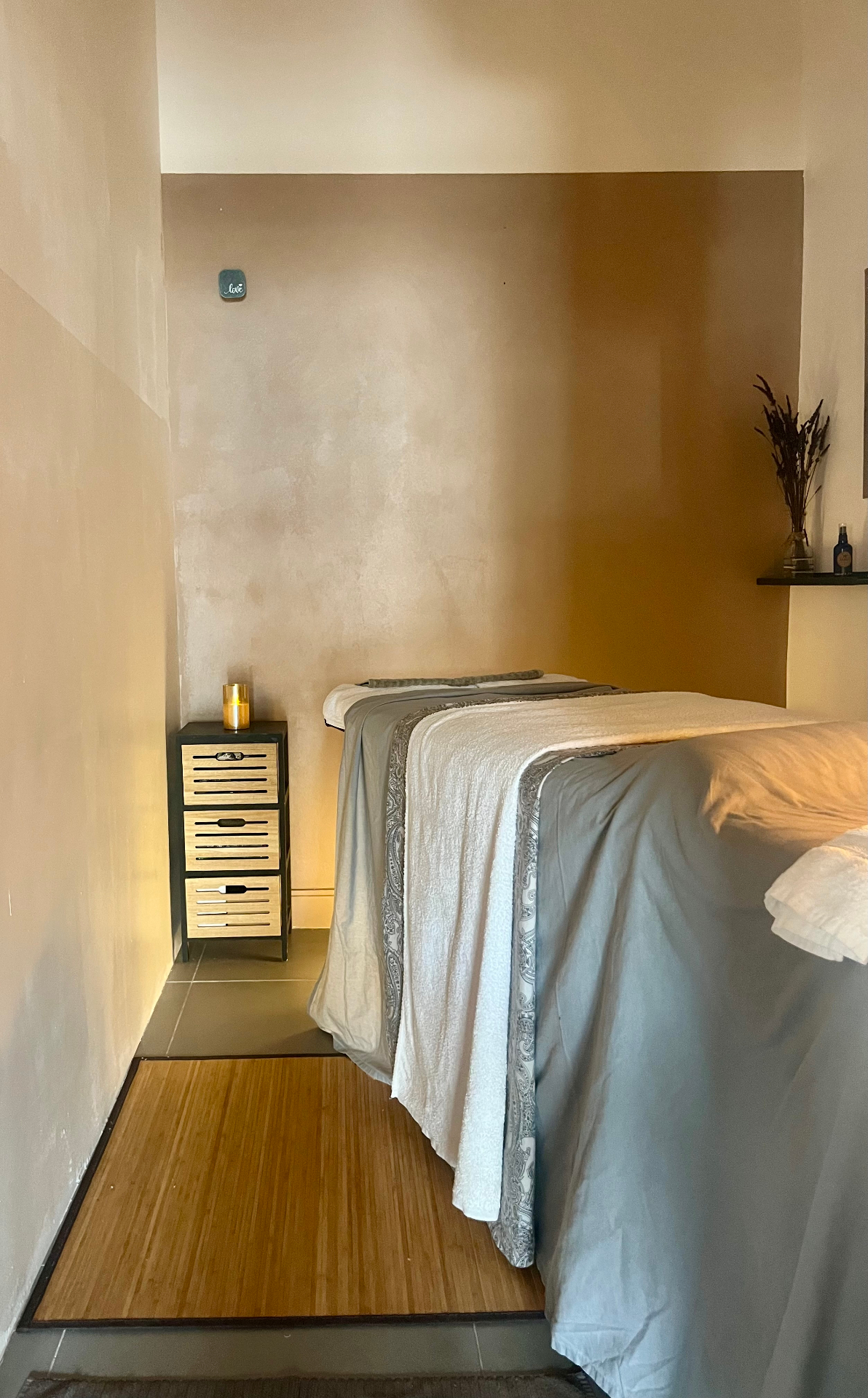 Warm, softly lit massage room at The Sanctum Space, Marbella.